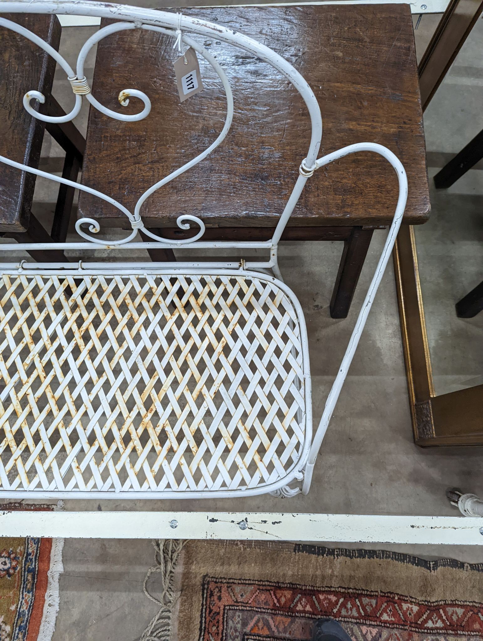 A French wrought iron garden bench, length 135cm, depth 50cm, height 96cm